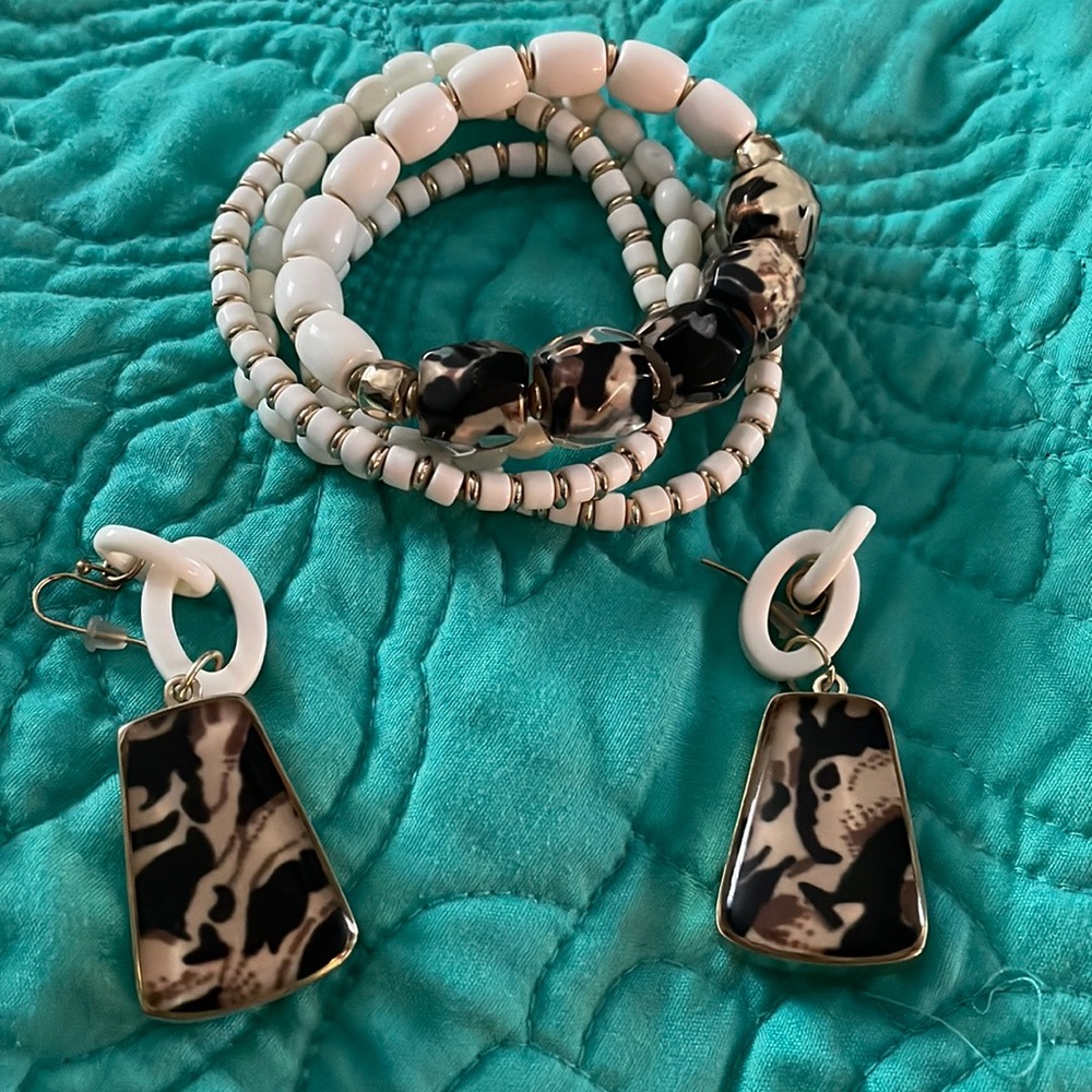 4 bracelets and pair of drop earrings.